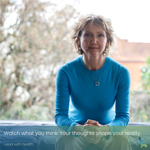 Woman sitting in interoception - introspection. Caption reads: Watch what you think. Your thoughts shape your reality. Footer: Lead with Health.