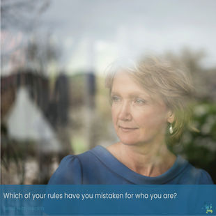 Woman looking out a window reflecting on perhaps the most dangerous sentence in the English language might be: "That's just who I am." Caption reads: Which of your rules have you mistaken for who you are? Lead with health.