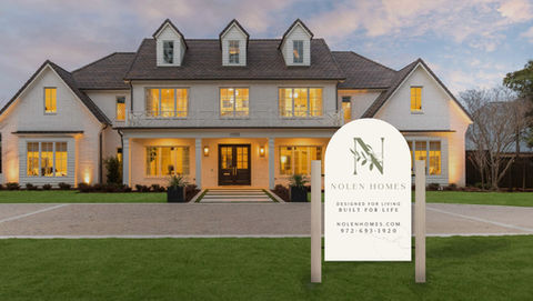 Development sign for Nolen Homes in front of a single family home