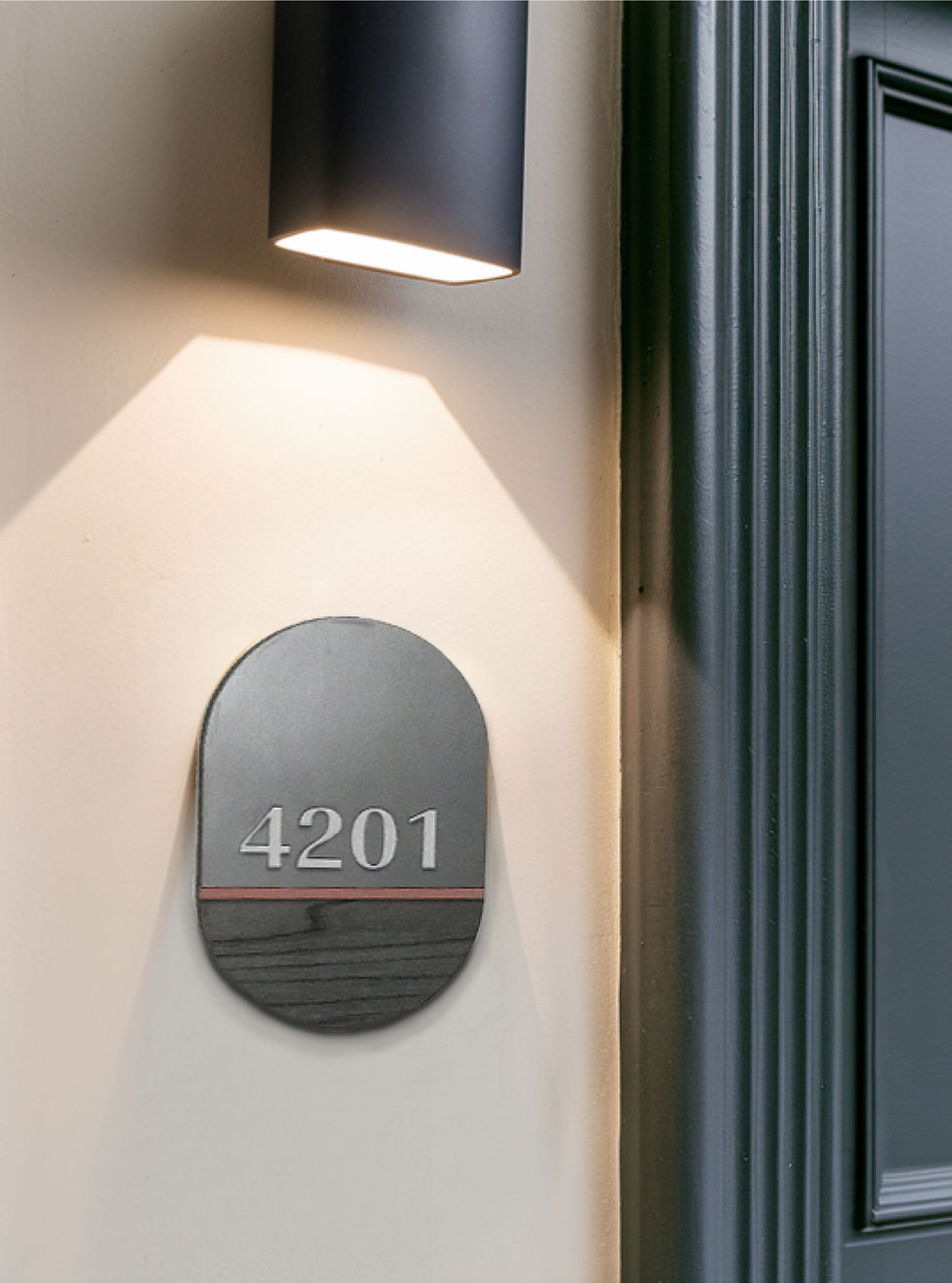 Unit number plaque with The 1846 branding mounted on exterior wall