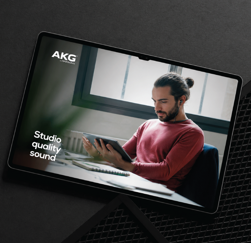 Tablet displaying Samsung audio product page with person using headphones