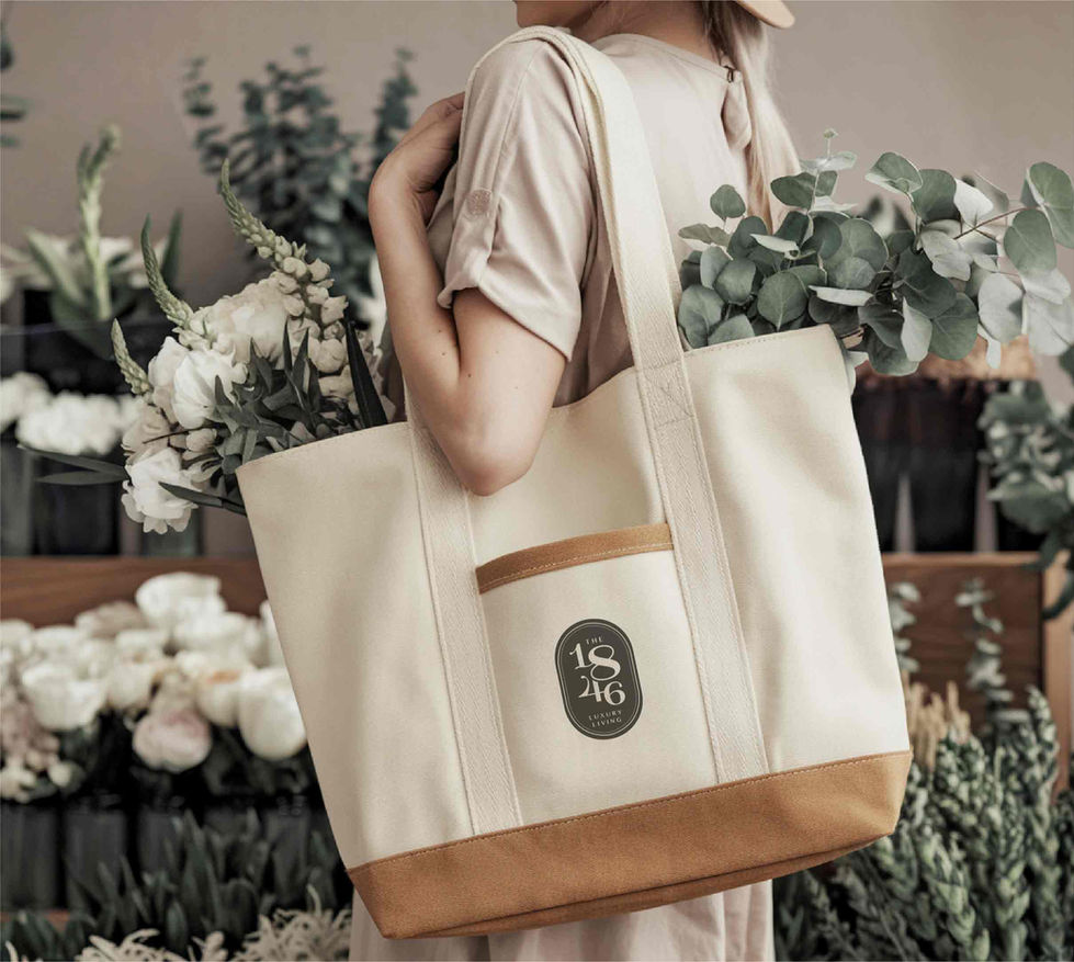 Branded tote bag with The 1846 logo held by person in lifestyle setting