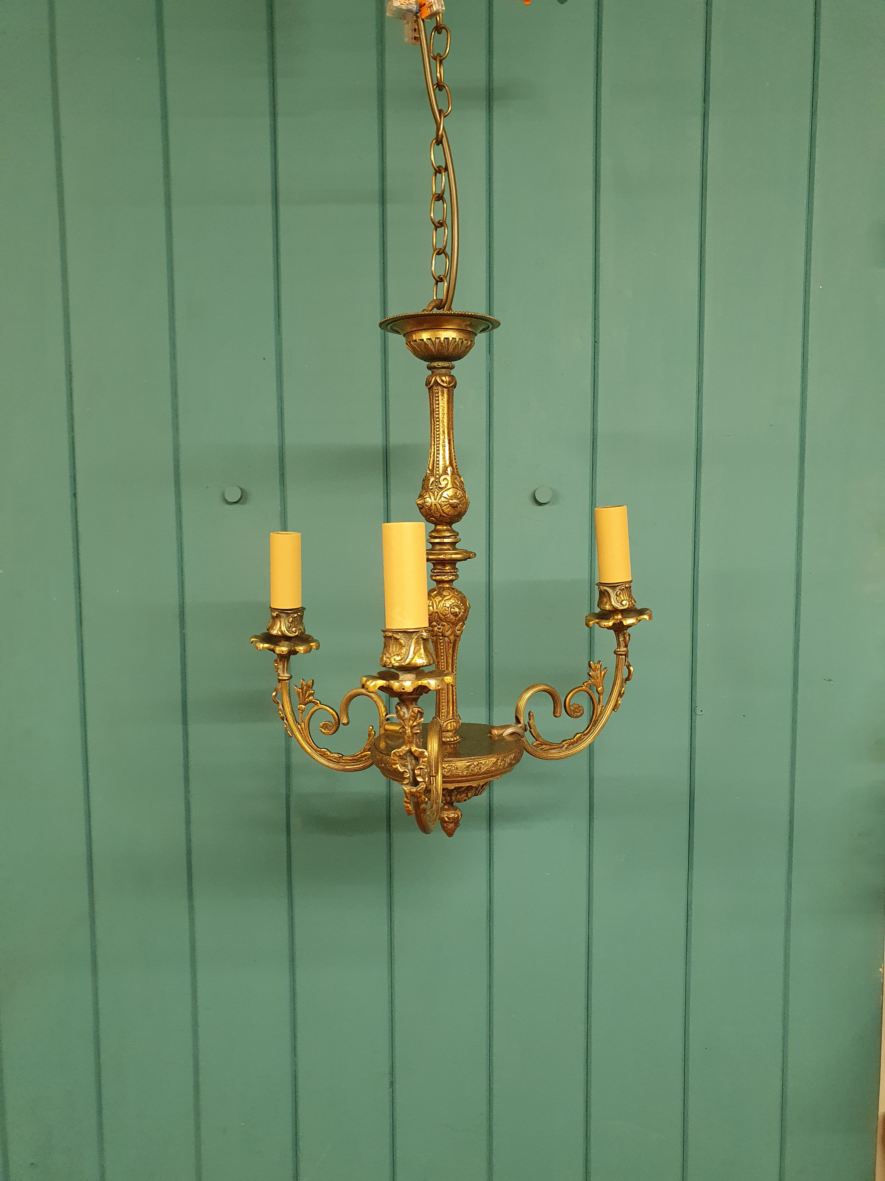 Antique three arm brass chandelier