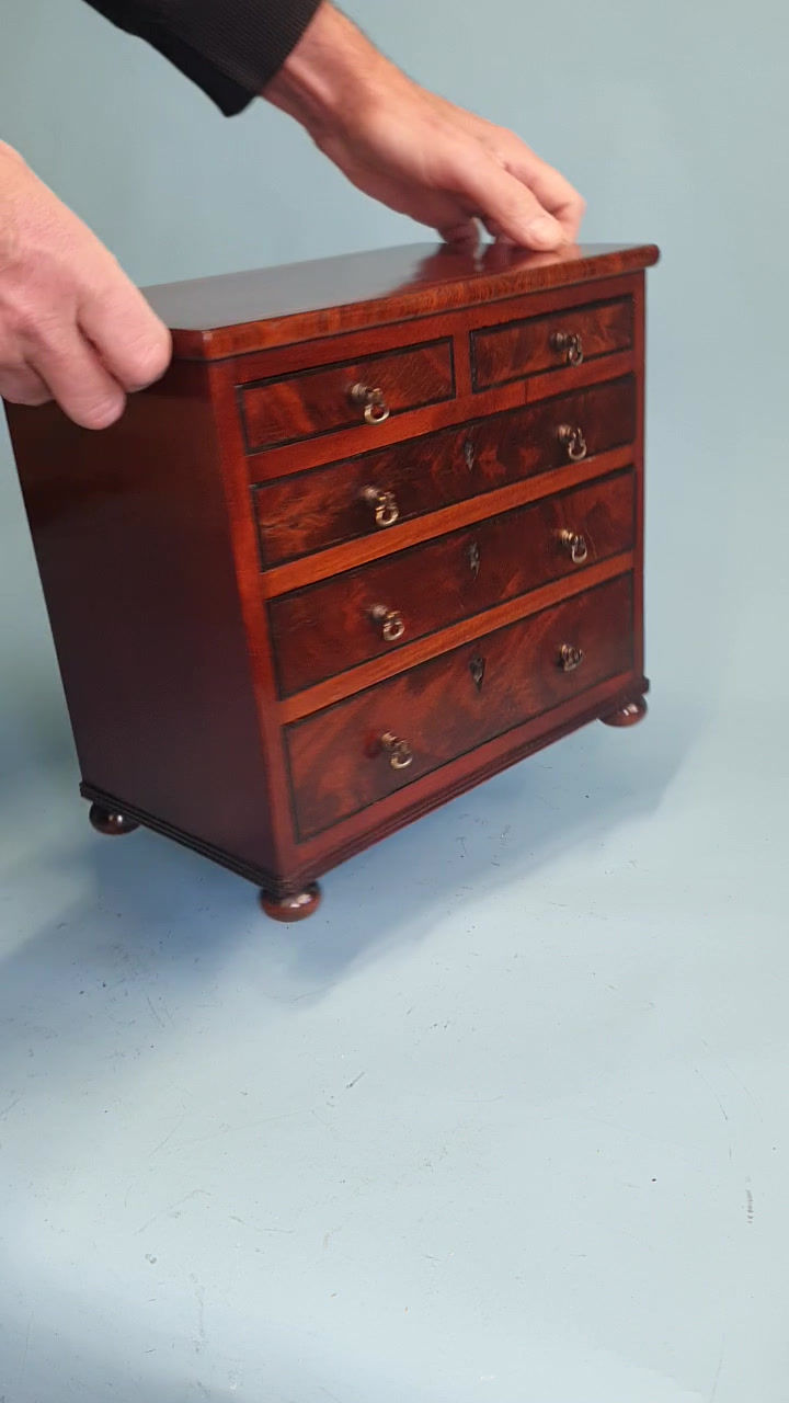 Thumbnail: Early 19th century miniature 2/3 mahogany chest of drawers dated 1824.