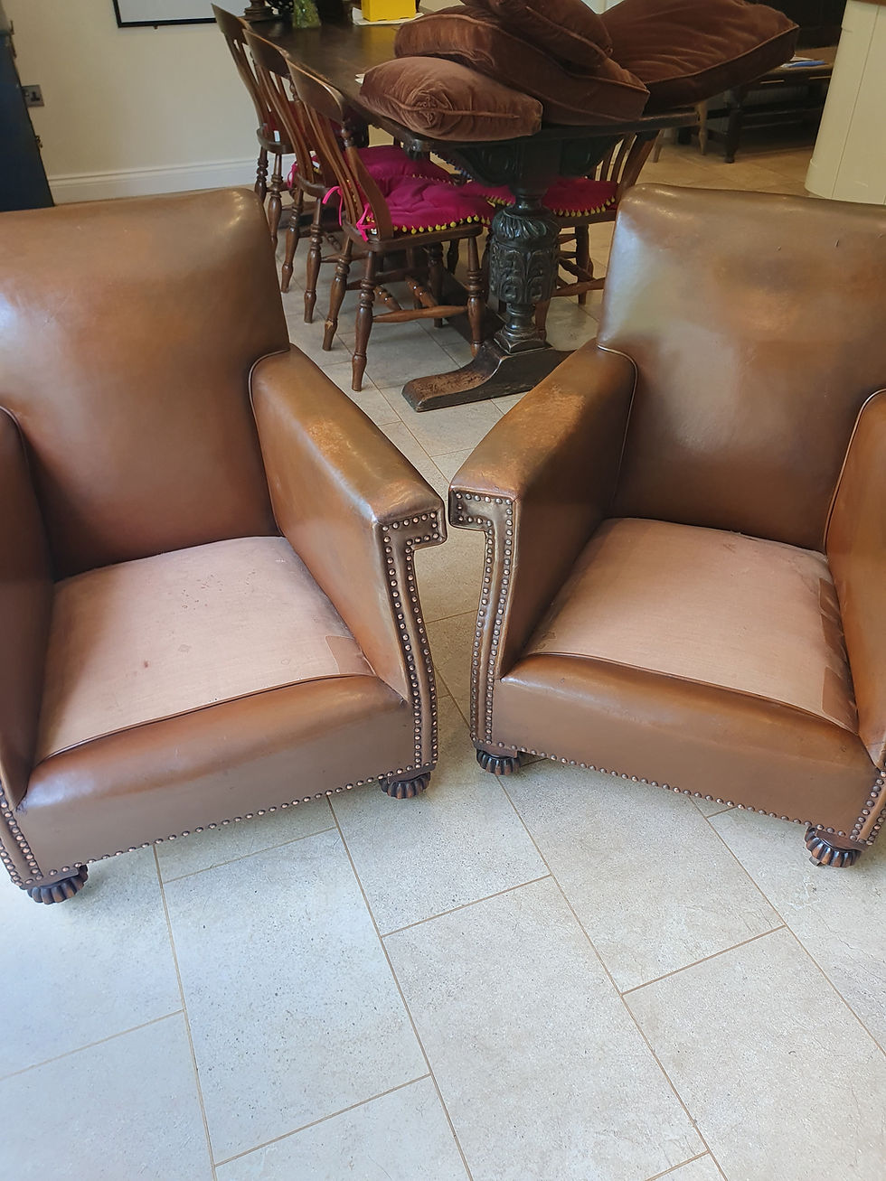Thumbnail: Early 20th century pair of chocolate brown leather chairs
