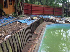 Railway Sleeper wall and timber deck added to swimming pool in Bishops Stortford.