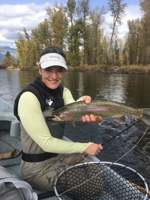 Photo of a fisherman holding a caught fish