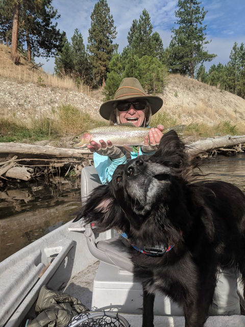 Photo of a fisherman holding a caught fish