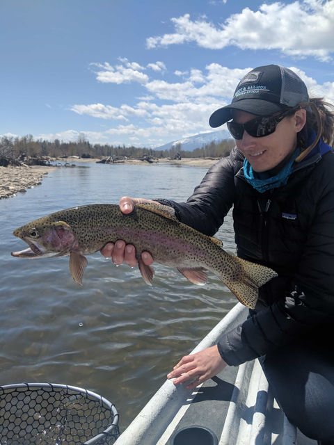 Photo of a fisherman holding a caught fish