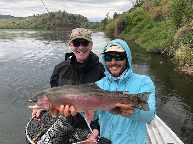 Photo of a fisherman holding a caught fish