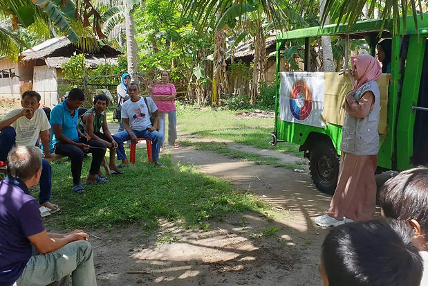 UCP Practitioner talking to locals.