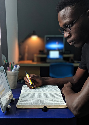 photo-of-man-reading-a-book-2574616.jpg