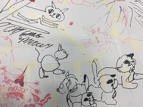 Zoom in of the workshop drawing: Several cats have been drawn, above it has been writting "Cat gang "MEOW!""
