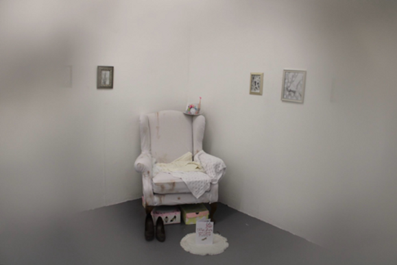 Image of the layout of the shoe, shows a couch and framed pictures