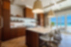 Modern kitchen with wood cabinets and marble island