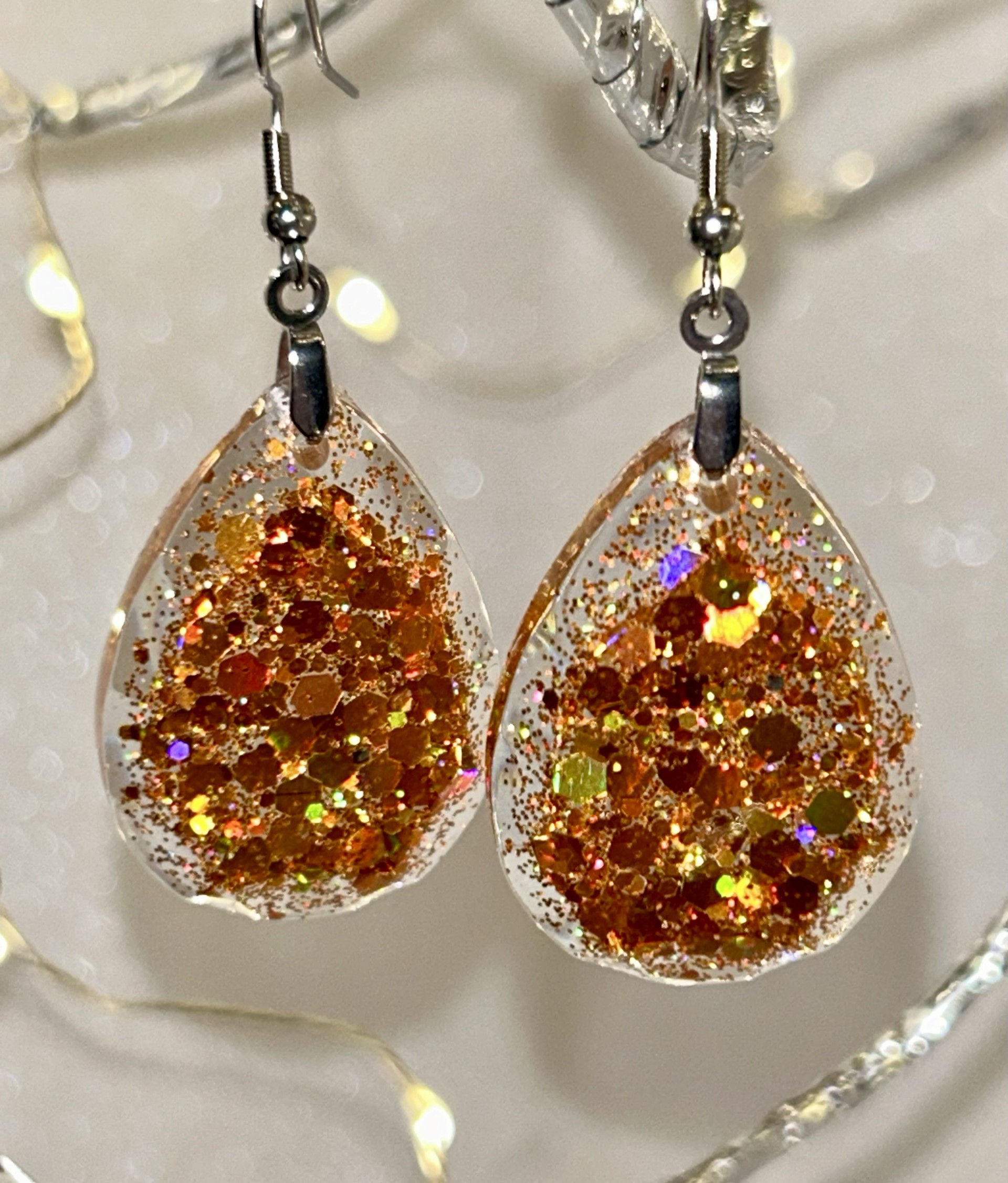 Orange resin stainless steel pear-shaped pierced earrings
