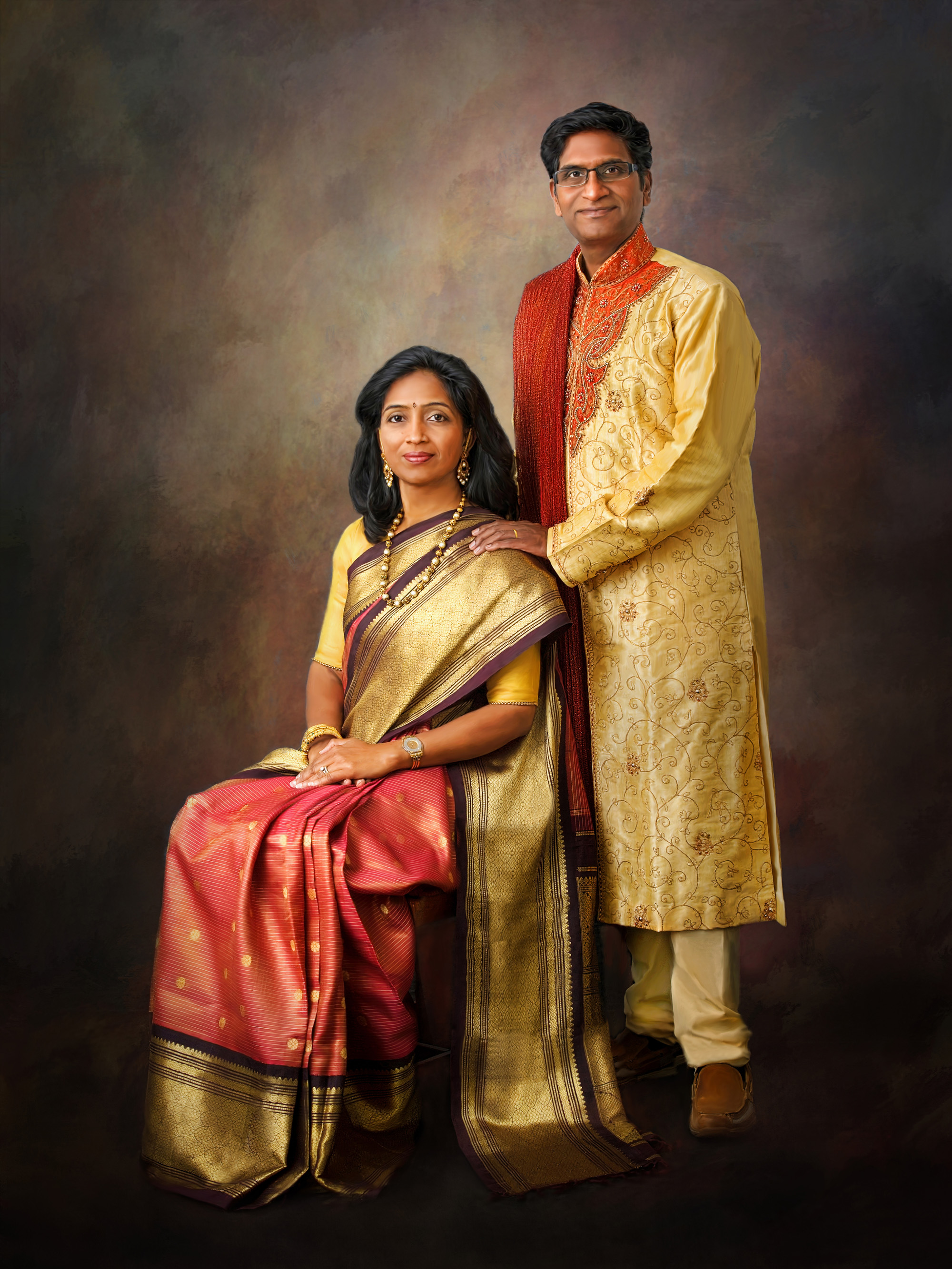 Fine art couple portrait in traditional gold and red attire