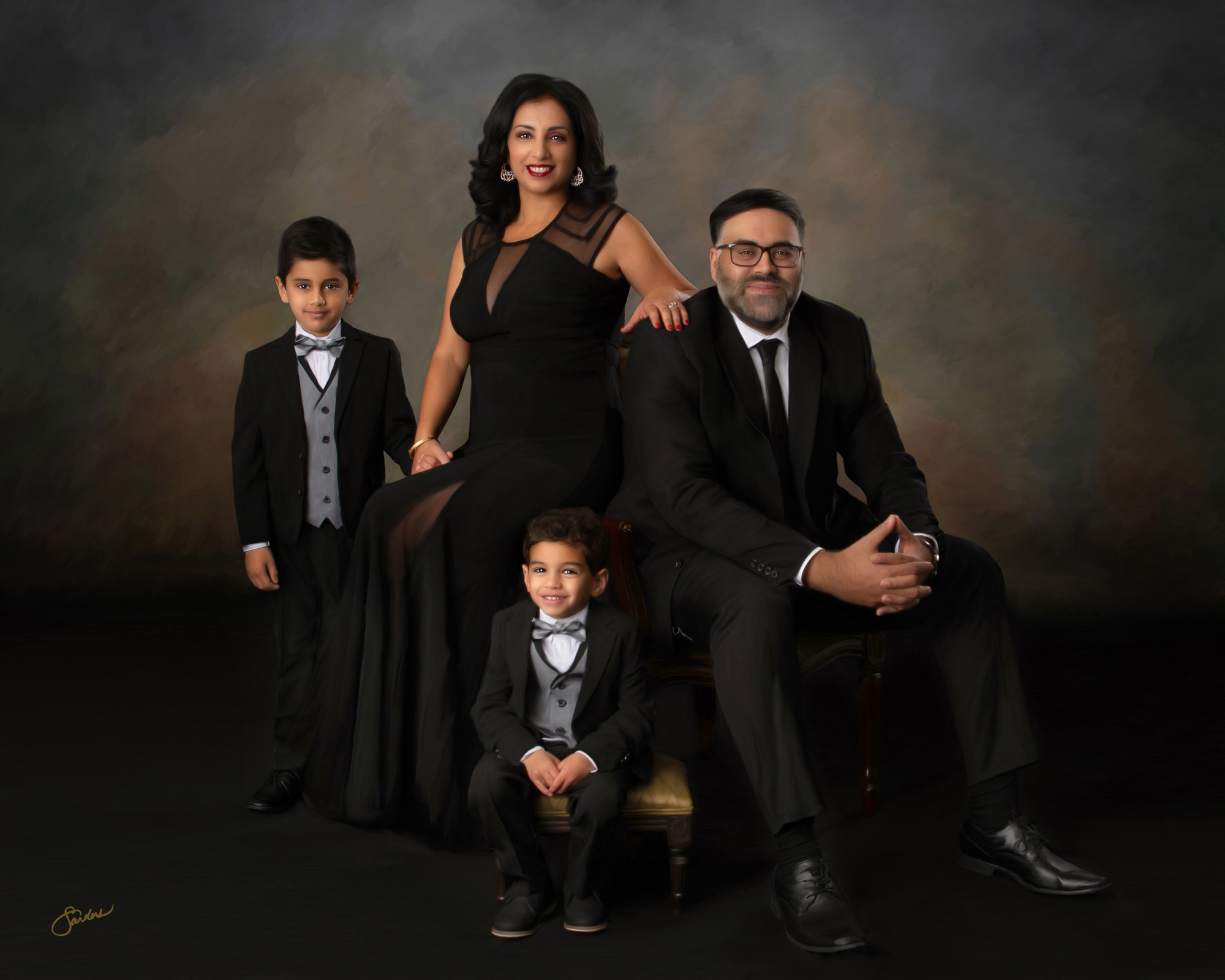 Fine art family portrait of parents and two sons in formal black attire
