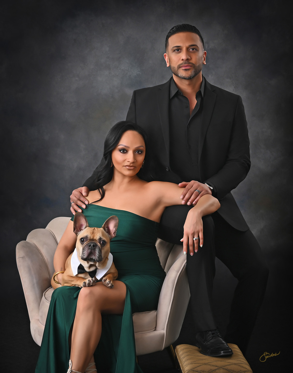 Fine art couple portrait with their French bulldog, woman in an emerald gown