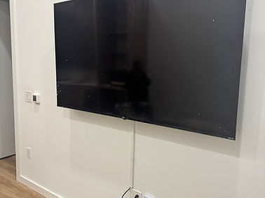 70" ONN TV Mounted and cables concealed in cable Harrison, New Jersey concealer tube