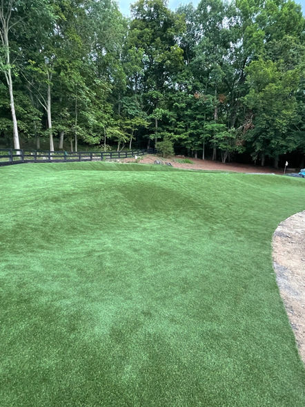 View of synthetic artificial golf putting green bunker
