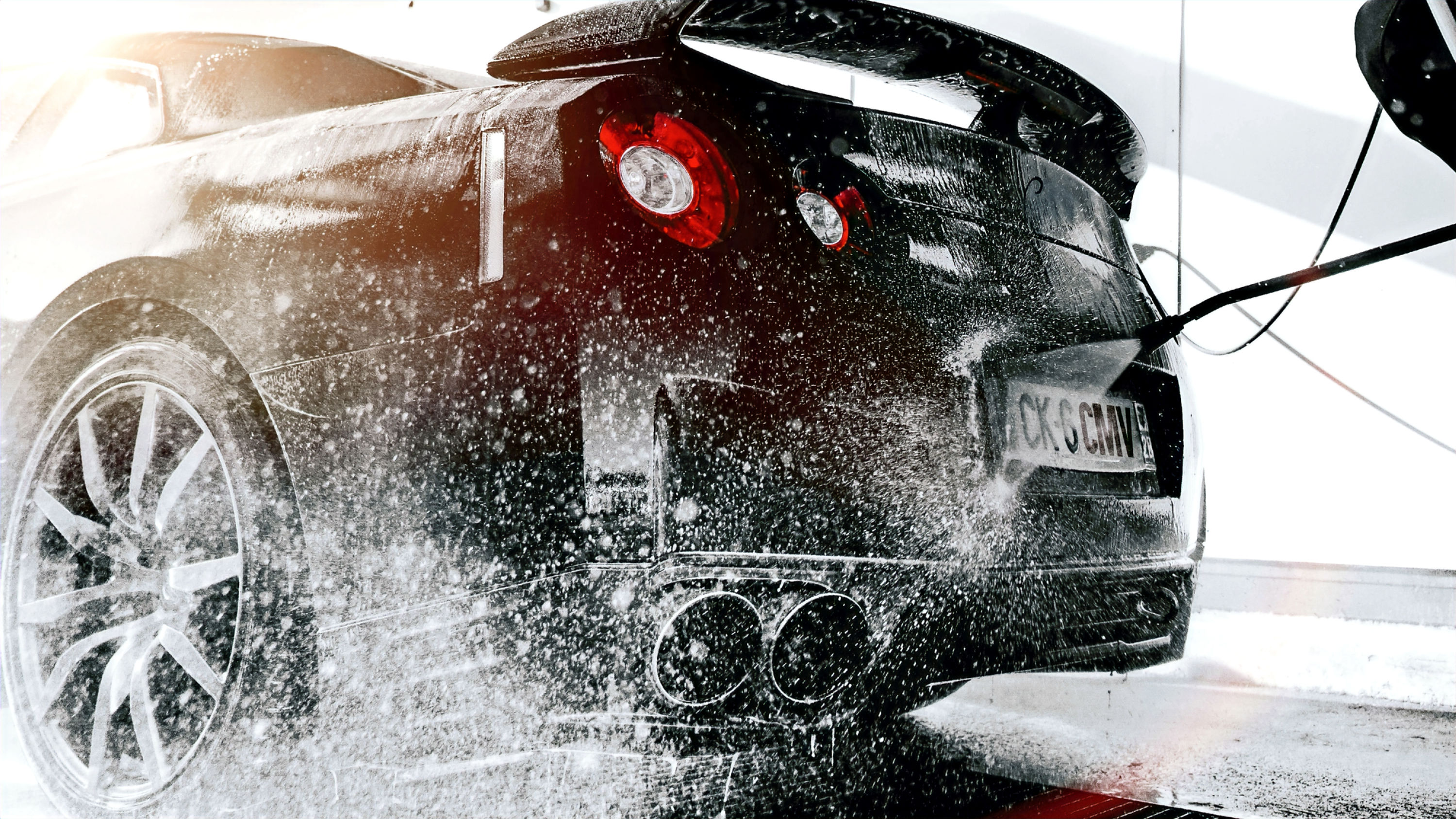 Detailer polishing car exterior to enhance paint gloss and remove light scratches