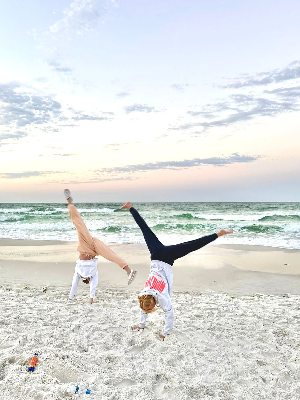 girls doing cartweel on beach