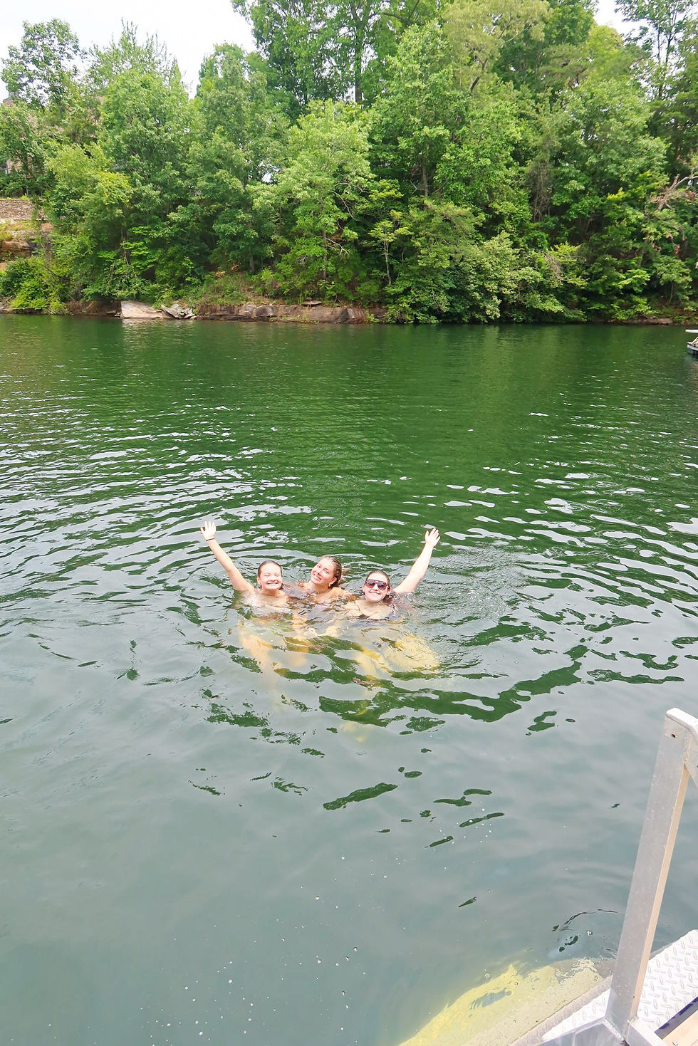 three girls in a lake
