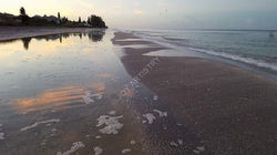 sunset reflection Plays on Beach