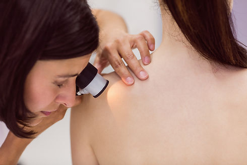 dermatologist-examining-skin-of-patient-with-dermatoscope.jpg