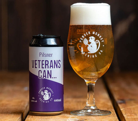 Veterans Can logo with symbolic challenge coin and community imagery—veteran-owned social enterprise promoting connection, empowerment, and positive change.