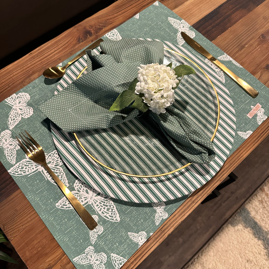 Stylish striped charger plate cover made from high-quality fabric, adding a modern twist to your table setting.
