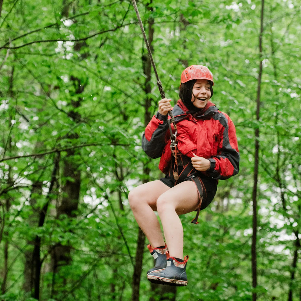 A student riding a zipline