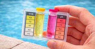 testing swimming pool water quality using a liquid test kit.jpg