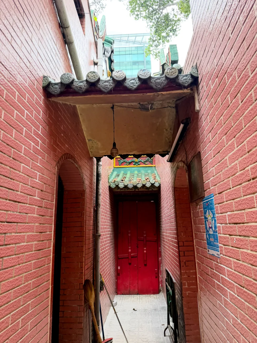 Red brick passage and tiled gateway inside the temple.