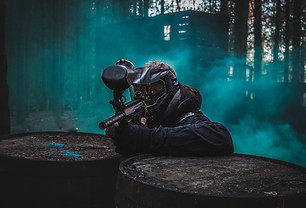 paintball player with smoke bomb cover