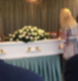 White coffin with flowers arranged by funeral directors Sydney