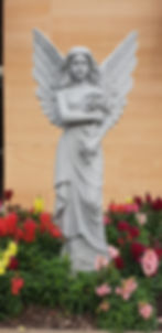 Angel statue in a flower garden for funeral directors Sydney