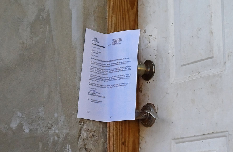 A photo of a letter of illegal occupation posted on a structure.