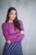beautiful-woman-purple-sweater-skirt.jpg