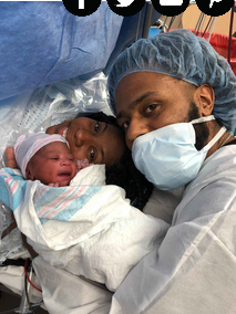 mom and dad with newborn after emergency cesarean