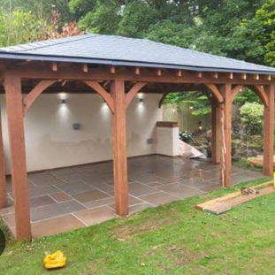 Polar white K-rend complete to back wall of kitchen, oak posts stained.