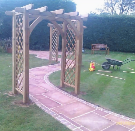 Combination of Indian stone and blockwork to create a winding garden path through new trellis arches in Birkdale. 