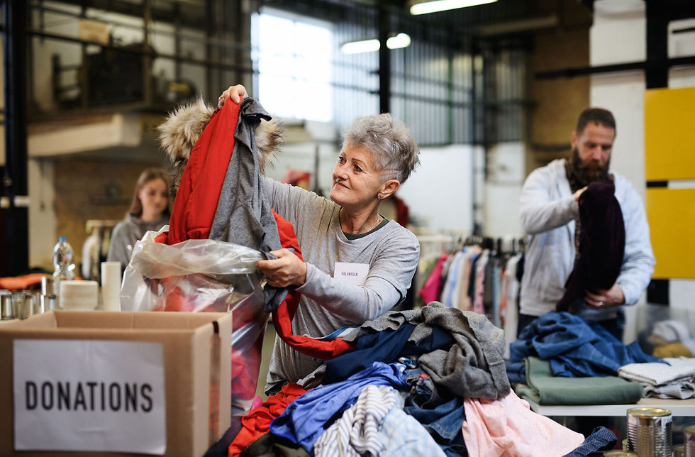 Volunteers sorting out donated clothes