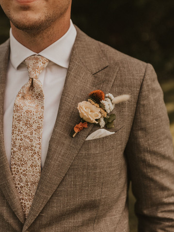 Groom boutonniere for late summer wedding at Horstmann Homestead in West Salem, WI