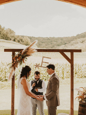 Arch flowers at late summer wedding at Horstmann Homestead in West Salem, WI