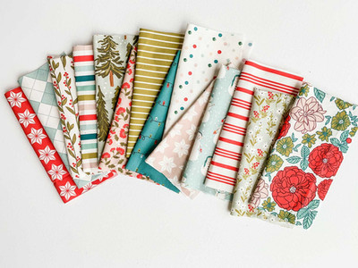 Bright red, blue, and green Holiday pattern on folded fabric