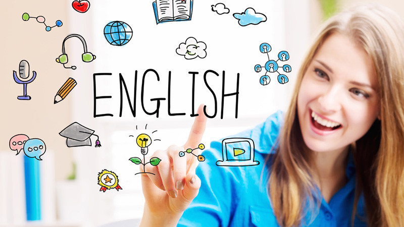 A smiling woman clicking on the word English