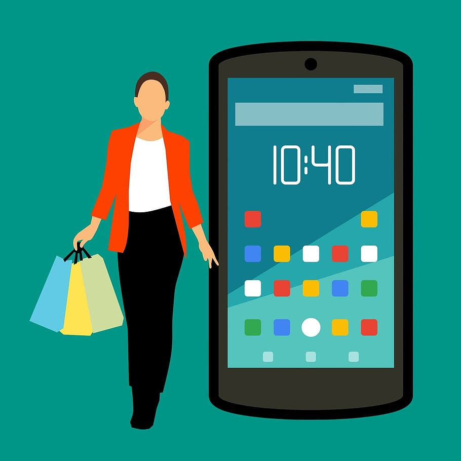 A woman with shopping bags and a mobile phone
