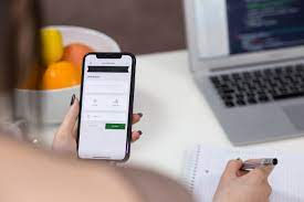 A woman taking notes from her mobile phone